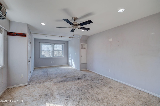 unfurnished bedroom featuring light colored carpet and ceiling fan