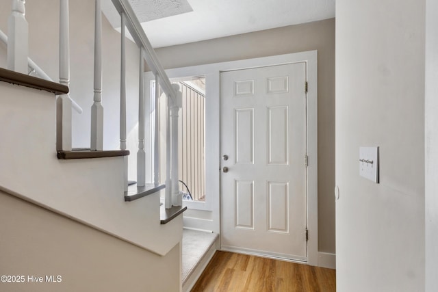 entrance foyer with light wood-type flooring