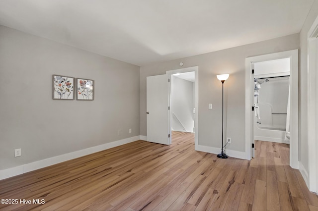 spare room with light wood-type flooring