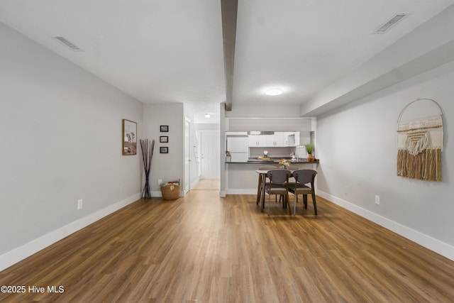 dining area with light hardwood / wood-style floors