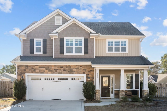 craftsman-style house featuring a garage and covered porch