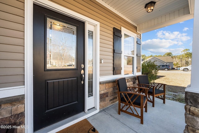 entrance to property featuring covered porch