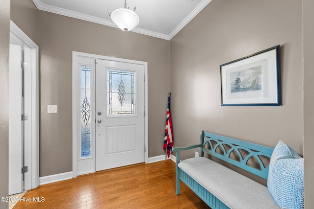 entryway featuring hardwood / wood-style flooring and crown molding