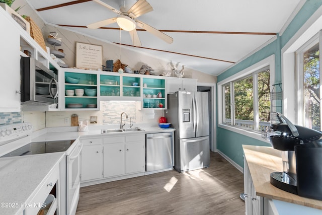 114 White Ash Dr, Pine Knoll Shores, NC 28512 - kitchen with stainless steel appliances, a sink, open shelves, backsplash, and lofted ceiling
