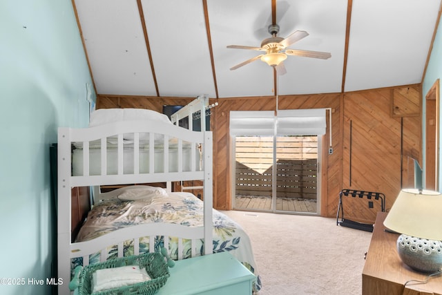 bedroom with carpet floors and wood walls