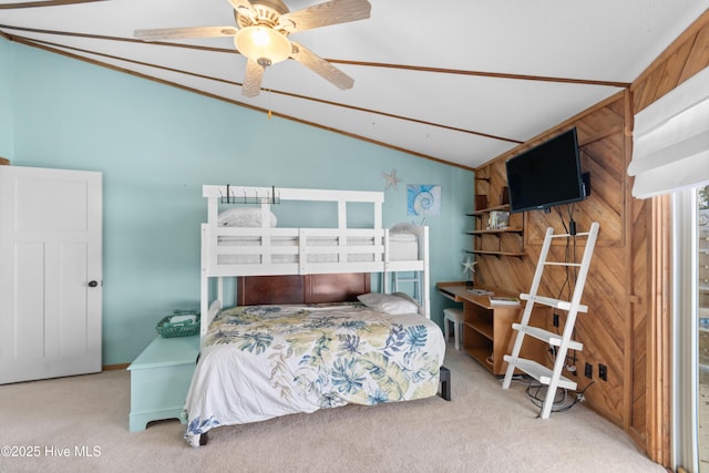 bedroom featuring ceiling fan, carpet floors, and vaulted ceiling