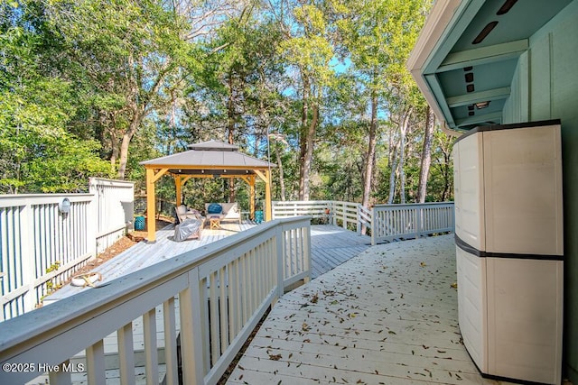 114 White Ash Dr, Pine Knoll Shores, NC 28512 - wooden terrace with a gazebo and view of wooded area