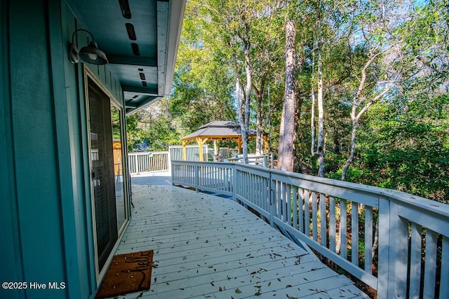 114 White Ash Dr, Pine Knoll Shores, NC 28512 - deck with a gazebo and view of scattered trees