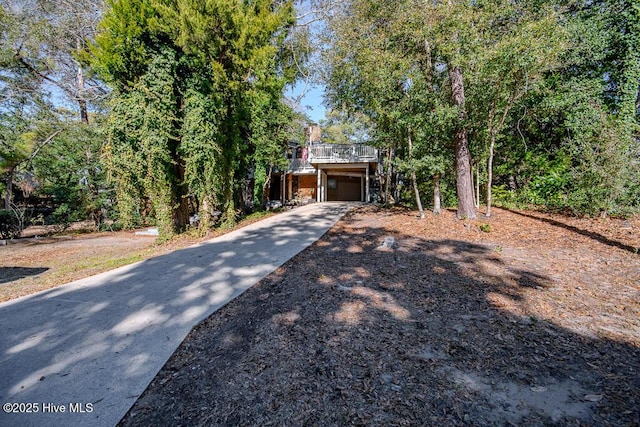 view of front of house featuring a deck and driveway