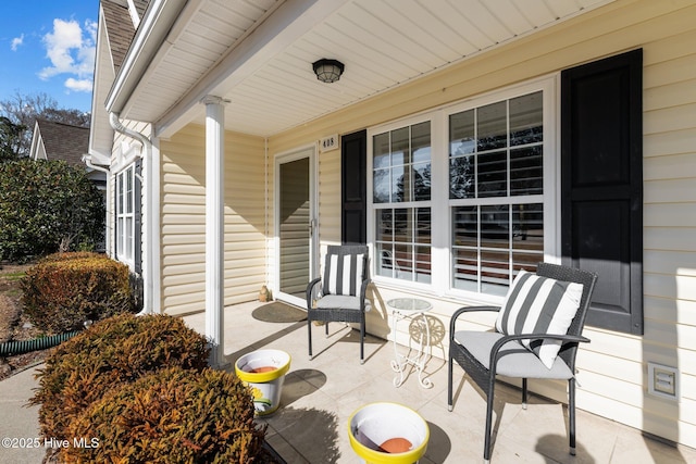 view of patio featuring a porch