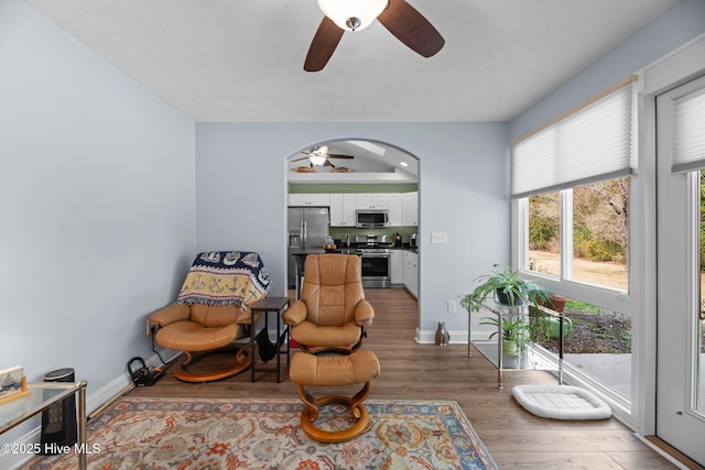 sitting room featuring hardwood / wood-style flooring and ceiling fan