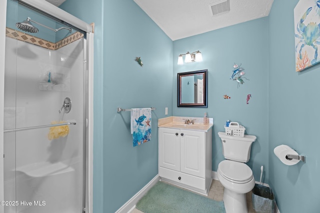 bathroom with toilet, a textured ceiling, vanity, a shower with door, and tile patterned flooring