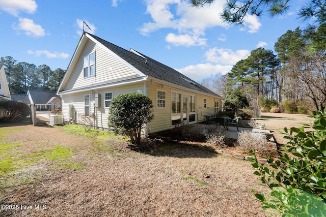 view of property exterior with a patio area and central air condition unit