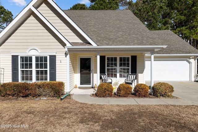 view of front of property with a garage and covered porch