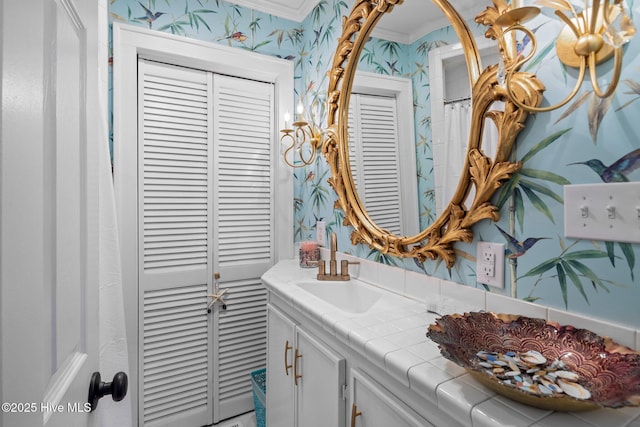 bathroom with vanity and crown molding