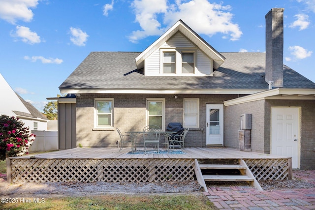 rear view of house with a wooden deck