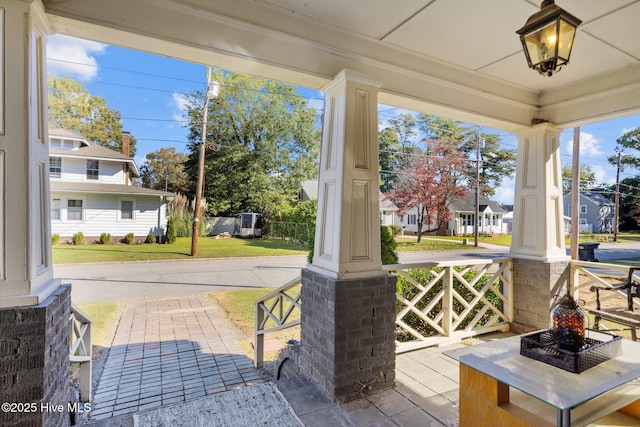 view of patio featuring a porch