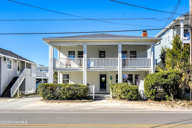 view of front of property with a balcony and covered porch