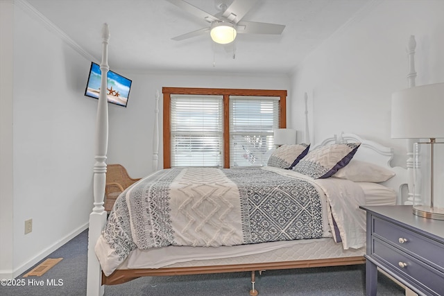 carpeted bedroom featuring crown molding and ceiling fan