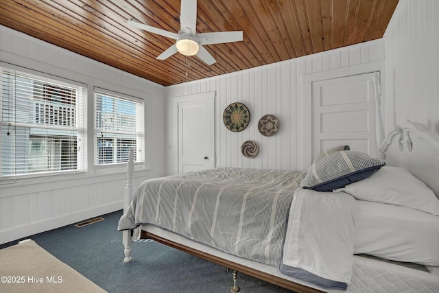 carpeted bedroom featuring ceiling fan and wooden ceiling