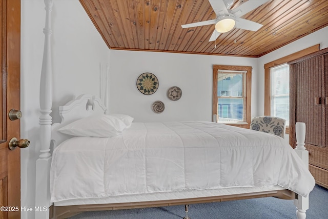 bedroom with ornamental molding, ceiling fan, and wood ceiling