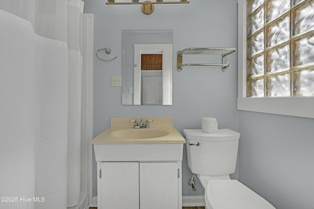 bathroom with vanity and toilet