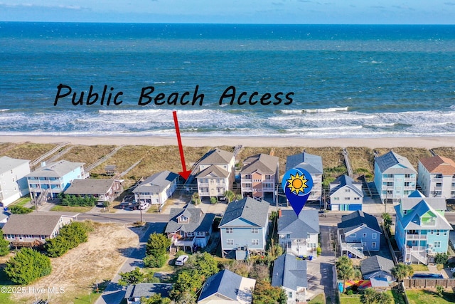 bird's eye view featuring a beach view and a water view