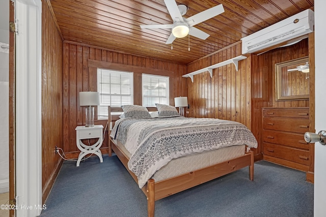 bedroom with wooden walls, carpet, and a wall unit AC