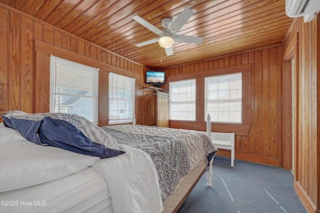 carpeted bedroom featuring a wall mounted air conditioner, wood ceiling, ceiling fan, and wood walls