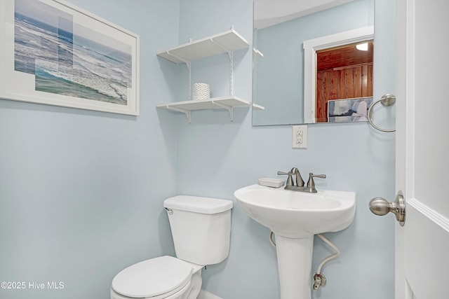 bathroom featuring sink and toilet