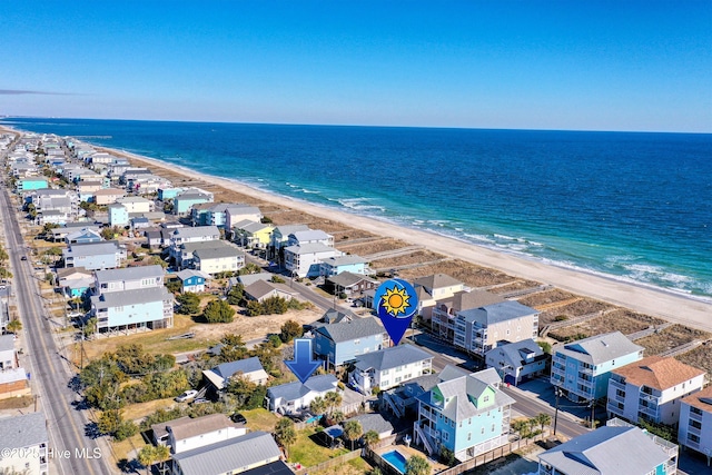 bird's eye view with a water view and a view of the beach