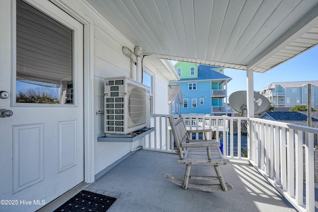 balcony featuring ac unit