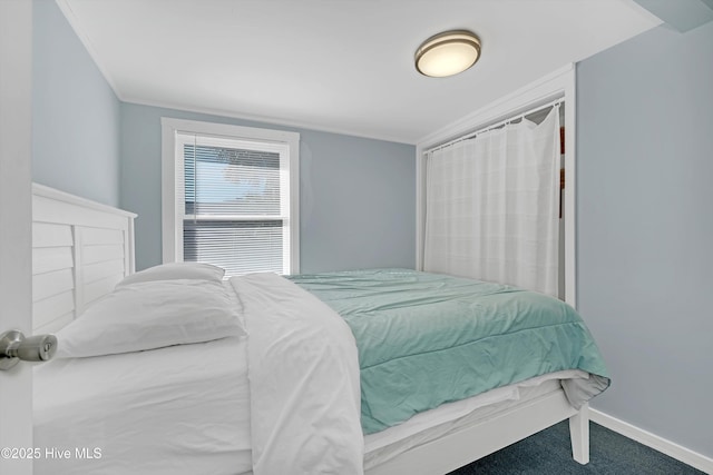 carpeted bedroom featuring ornamental molding