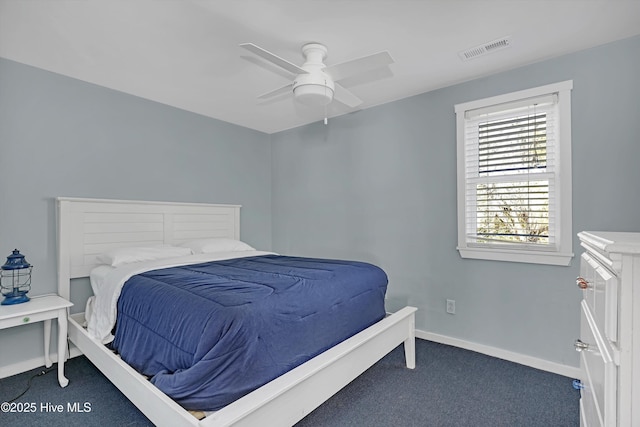 bedroom featuring ceiling fan and dark colored carpet