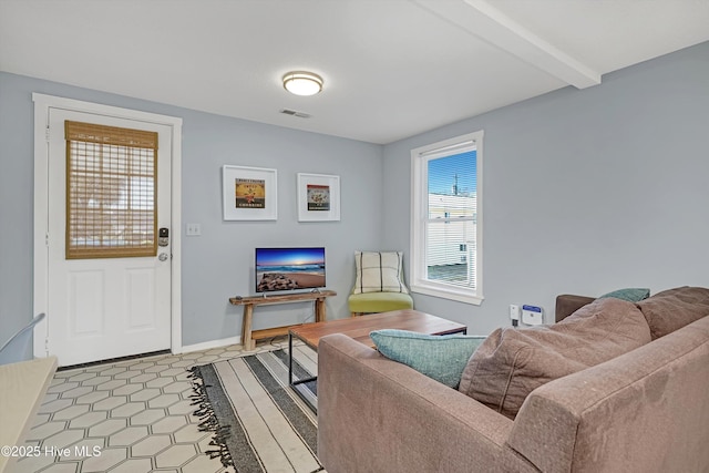 living room with beam ceiling