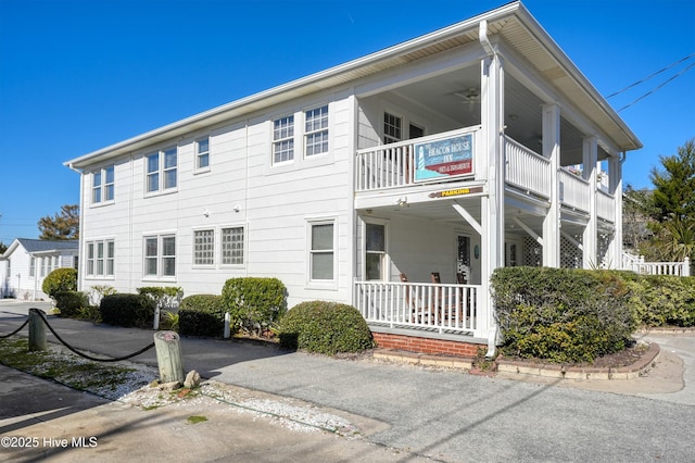 exterior space with a balcony and covered porch