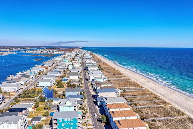 bird's eye view featuring a view of the beach and a water view