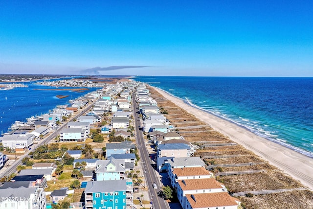 birds eye view of property featuring a view of the beach and a water view