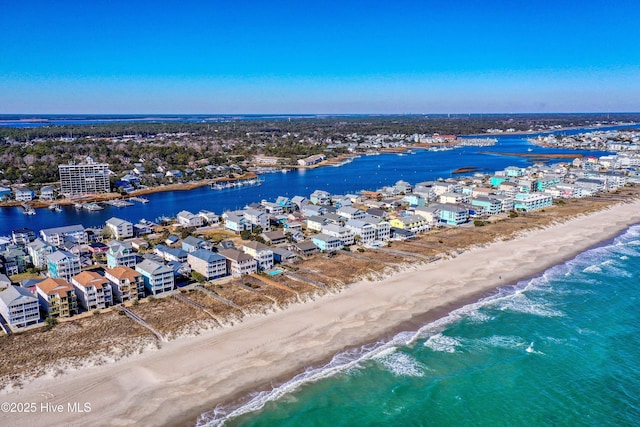 aerial view with a water view and a view of the beach