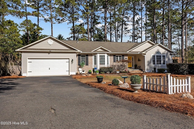 single story home featuring a garage