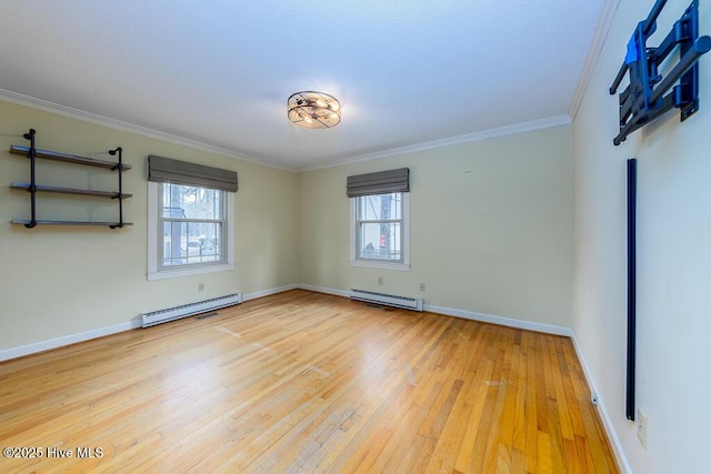 unfurnished room featuring a baseboard radiator, plenty of natural light, and light wood-type flooring