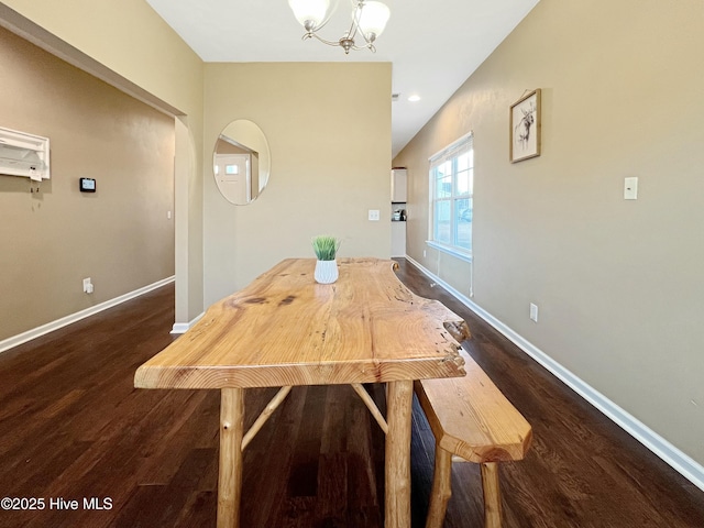 unfurnished dining area featuring dark hardwood / wood-style flooring and an inviting chandelier