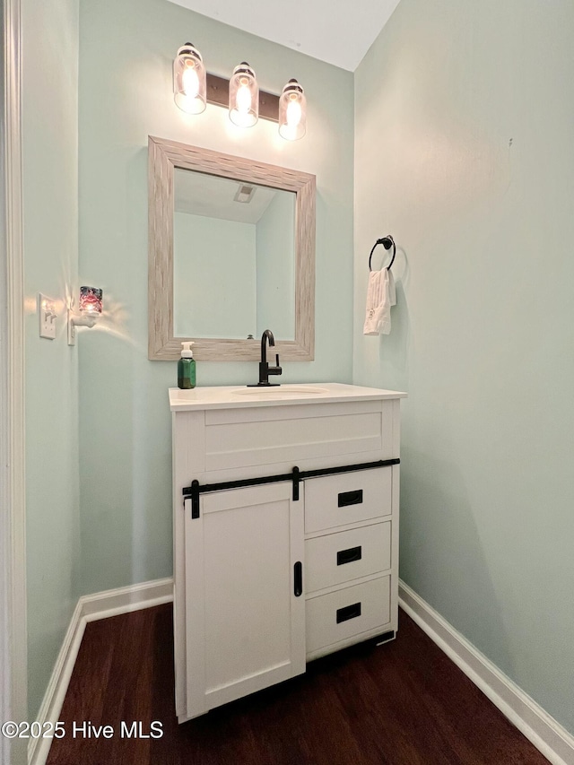 bathroom with wood-type flooring and vanity