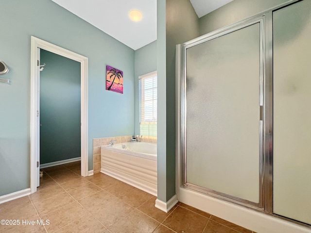 bathroom featuring tile patterned flooring and independent shower and bath