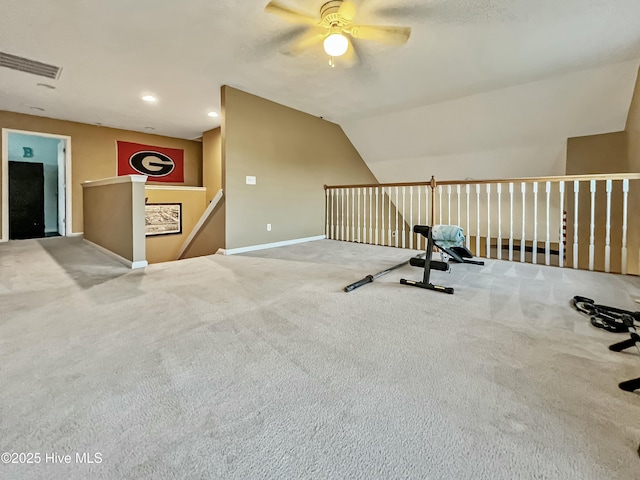 exercise area with light colored carpet and lofted ceiling