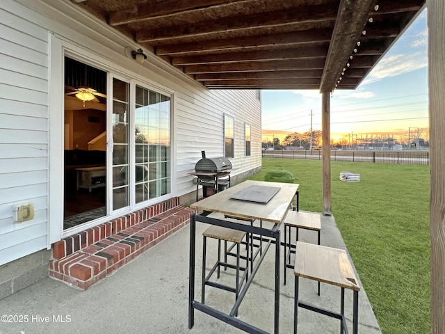 patio terrace at dusk with a yard