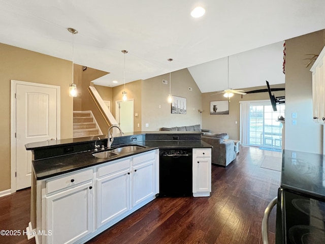 kitchen with vaulted ceiling, pendant lighting, black dishwasher, sink, and white cabinets