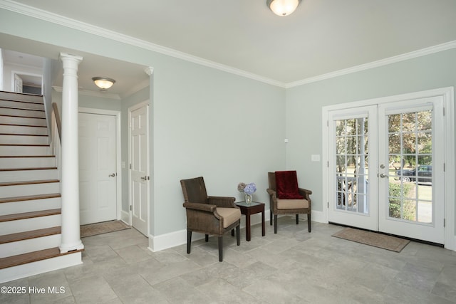 sitting room featuring ornate columns, ornamental molding, a healthy amount of sunlight, and french doors