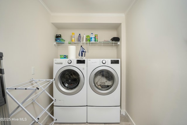 clothes washing area with crown molding and independent washer and dryer