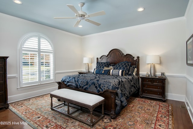 bedroom with wood-type flooring, ceiling fan, and crown molding